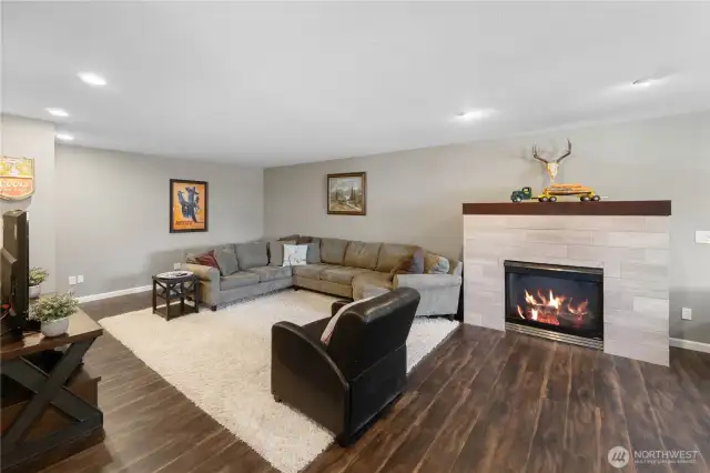 Rec room on the upper floor with a gas fireplace.