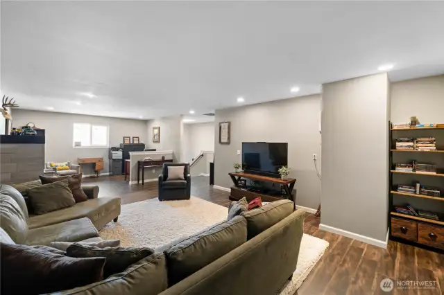 This rec room has it all Work space, plumbed for a wet bar, Plenty of space for a big screen TV.