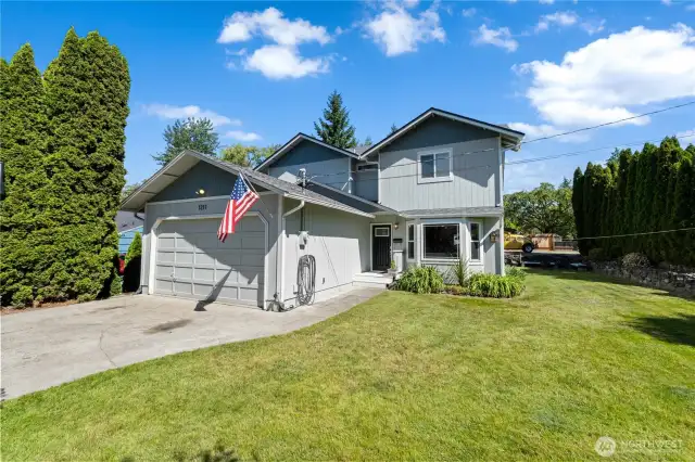 Front of house with a flat driveway and plenty of parking.
