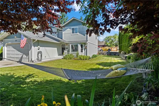 Relax and view your new home full of mature landscaping.
