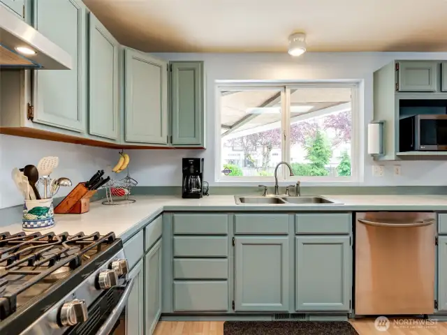Kitchen faces beautiful private backyard.