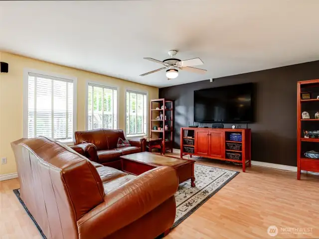 Light and bright family room located near peaceful backyard.