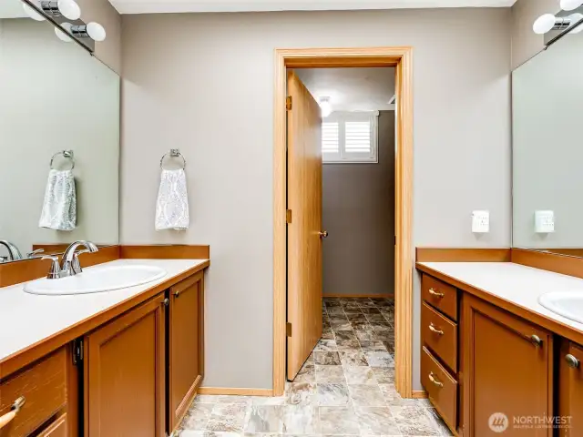 Primary ensuite with dual vanities.