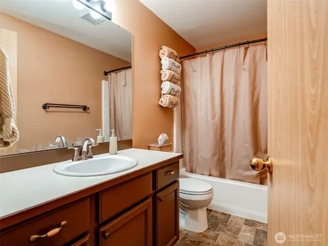 2nd floor guest bathroom with shower/tub combo.