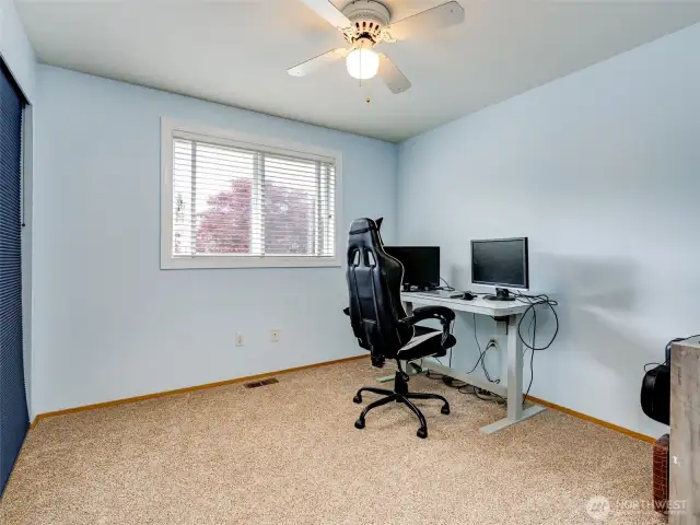 4th bedroom or office located near the serene backyard space.