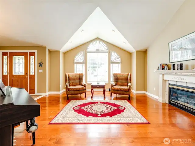 Light and bright living room with beautiful windows and plantation shutters.