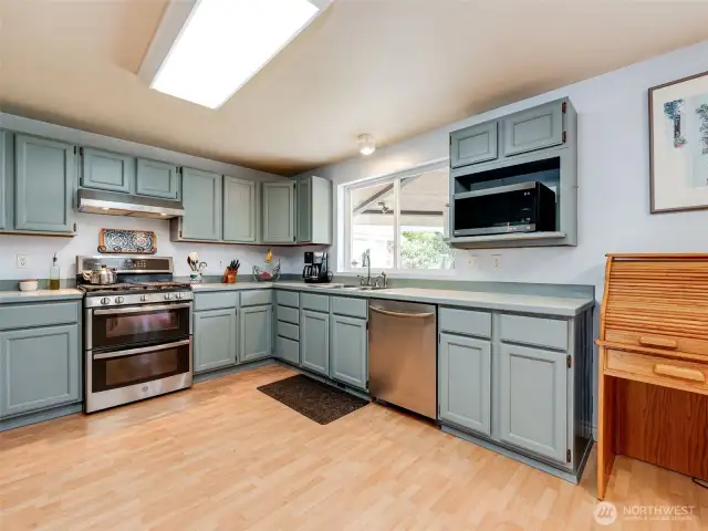 Kitchen with stainless appliances and double-oven.