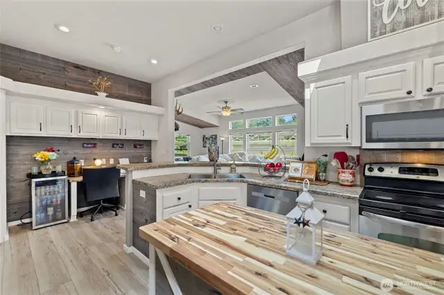 Light, bright, beautiful open floor plan chef's kitchen with stainless appliances and office space with lots of additional storage