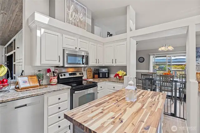 Light, bright, chef's kitchen with skylights, stainless appliances, pantry, and eat-in counter space