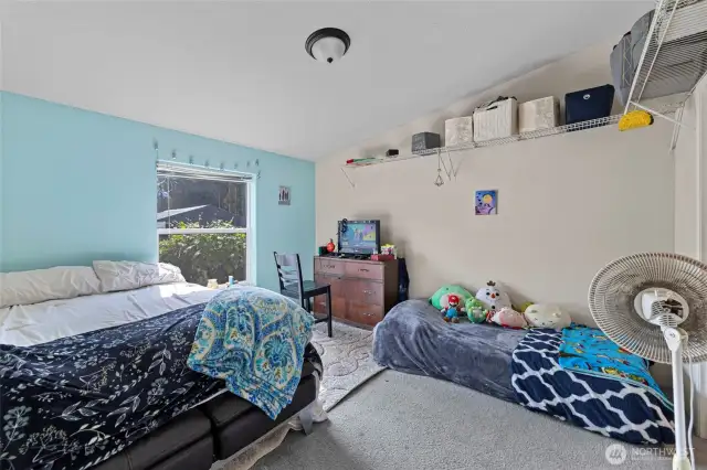 Primary bedroom with vaulted ceilings, large picture window and vaulted ceilings in 2nd home