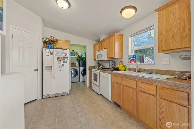 Light, bright kitchen in 2nd home with pantry