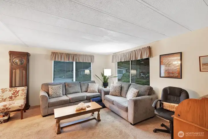 Formal living room has abundant natural lighting all day! Room will easily accommodate sofa, love seat, recliners. End tables and more furniture.