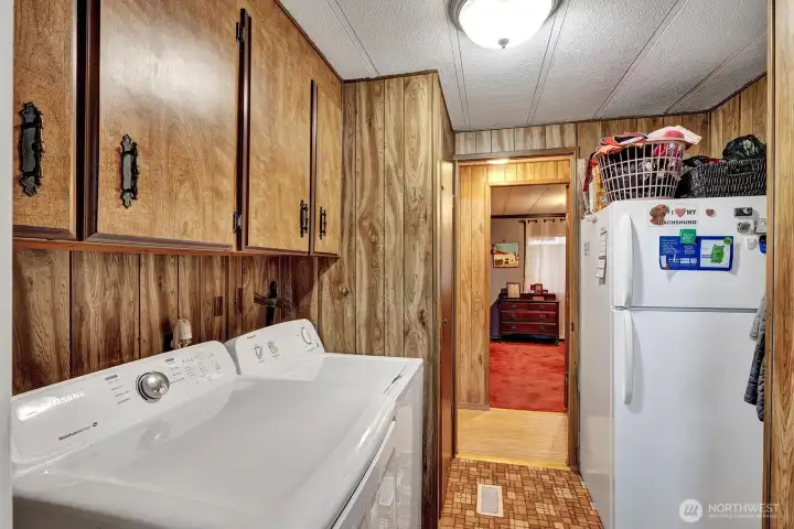 Utility room also has ample storage space for all your laundry necessities. Room for freezer if you choose. Access door to ramp that leads to the covered carport area or tot the backyard.