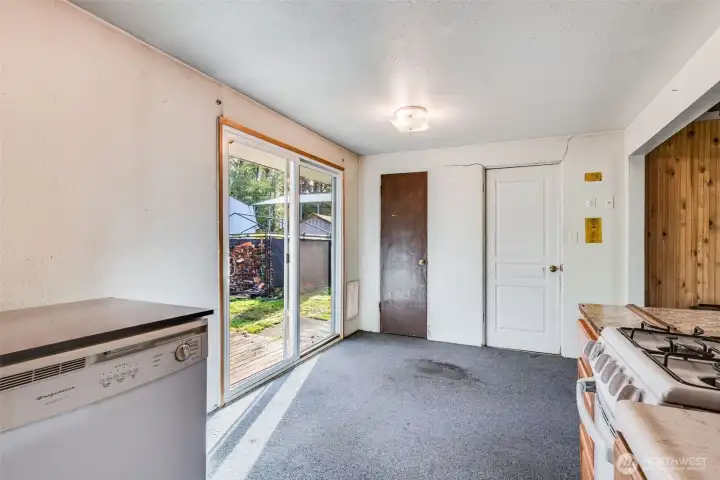 Located off the kitchen is  a dining area and a sliding door to the back yard.