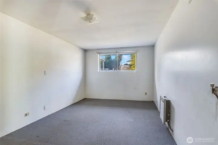 This oversized primary bedroom is located off the living room.