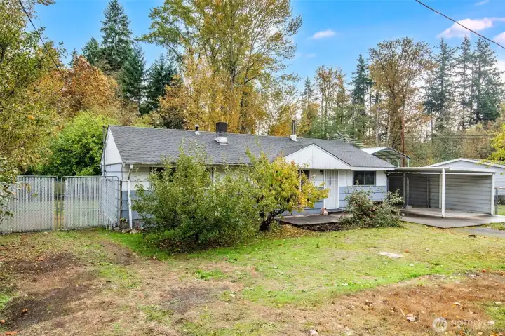 Outside, enjoy the spacious yard space with side gates for RV or boat parking.