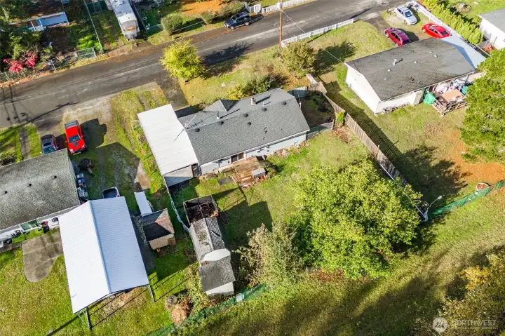 Another overhead view showing the two large storage sheds at the rear of the property.