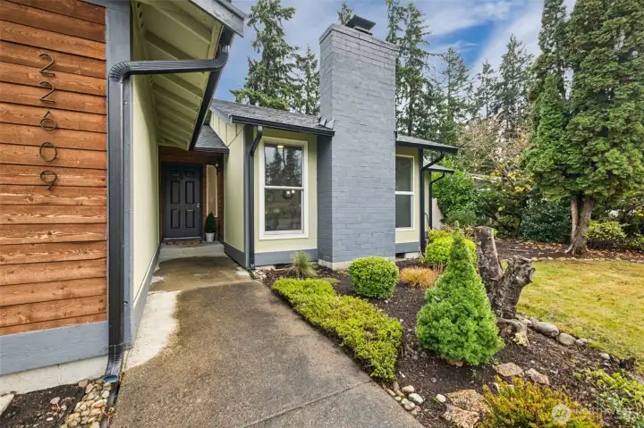 Step into a warm and inviting entry that immediately sets the tone for this thoughtfully updated home. Mid century modern comfort meets timeless style in every detail.