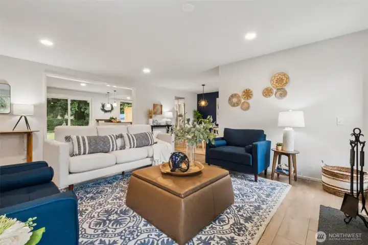 Abundant natural light makes the living room feel airy and open, whether you're gathering with friends or enjoying a quiet evening at home. New LVP flooring throughout the main living area brings modern style and effortless care.