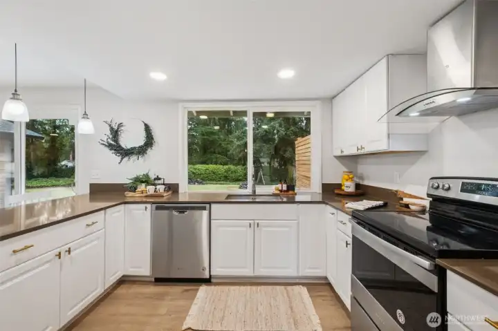 Updated cabinetry and smooth granite surfaces add both beauty and function. Modern stainless appliances anchor the kitchen upgrade. Stylish, durable, and perfect for home chefs.