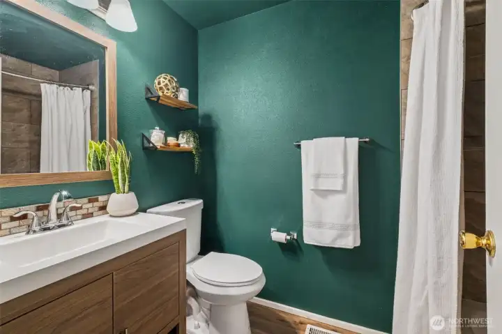 Tastefully updated with modern tile and a new vanity, the full bath feels polished and refreshed. It’s move-in ready with a timeless look.