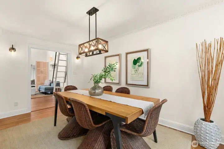 Beautiful classic dining room perfect for entertaining with french doors leading to the expansive front deck