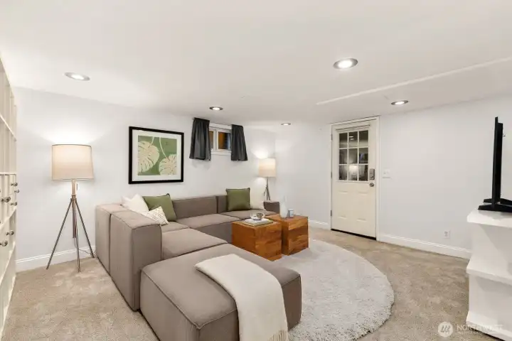 The lower level offers flexible living spaces, with a separate entrance