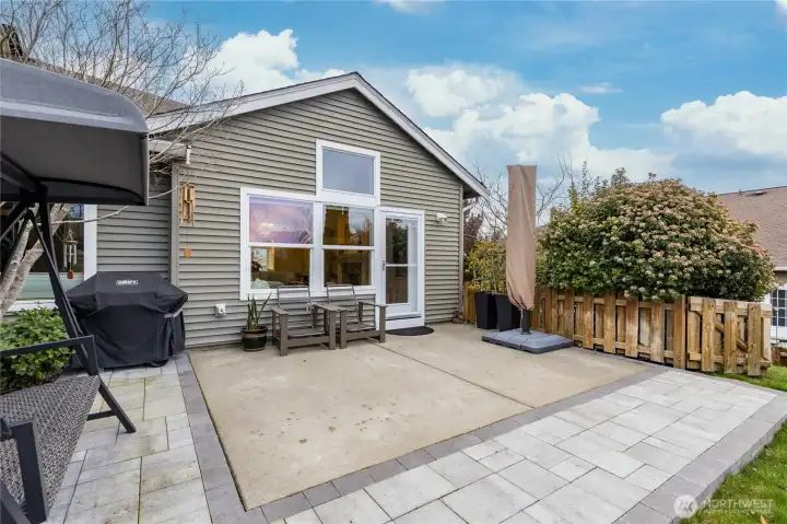 Spacious patio off the living room, extended in 2025 with professionally-installed pavers for the ultimate outdoor entertaining space