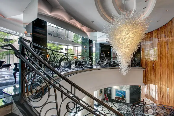 grand 2 story lobby with 2 zoom office room