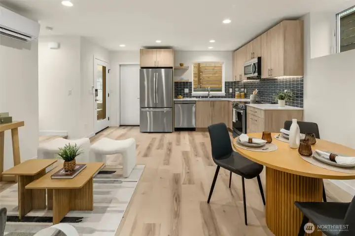 Kitchen opens to living and dining areas.