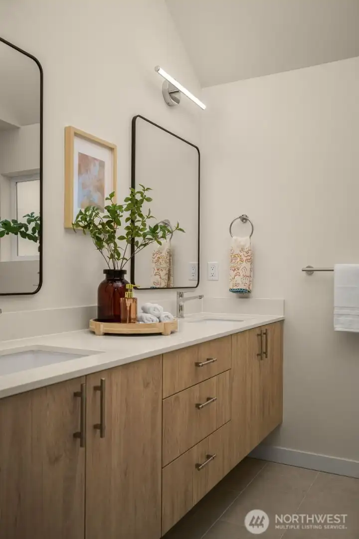 Primary 3/4 bath with dual sinks.