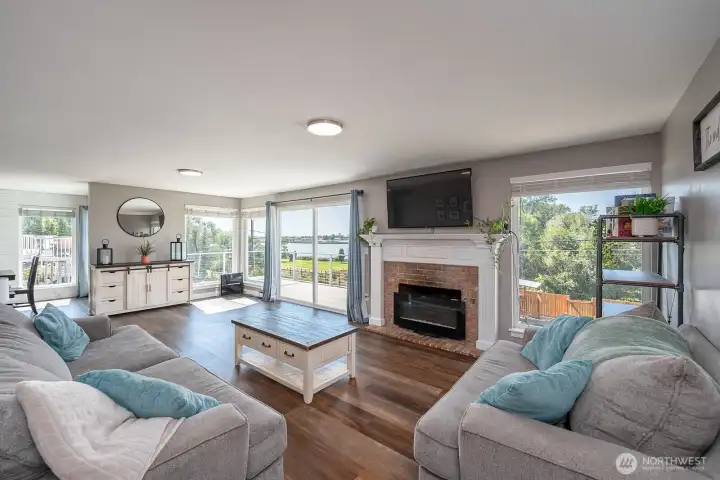 Gorgeous Living area just off the entryway featuring wood fireplace