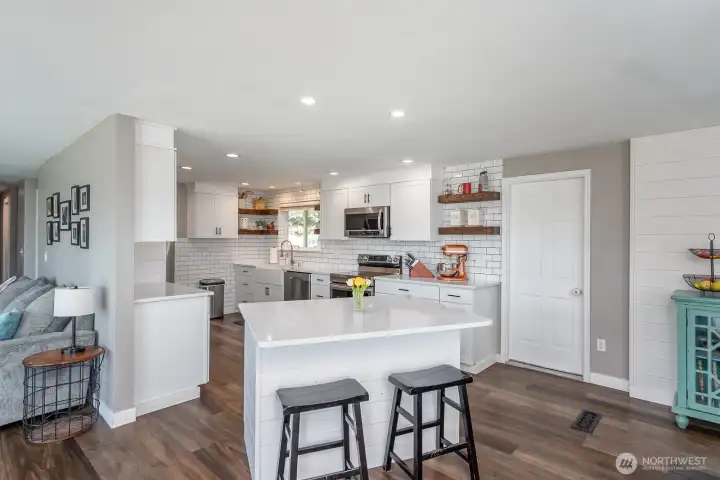Tastefully modernized kitchen With island for quick snacks!