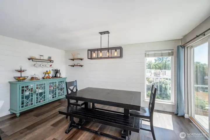 Dining area with more big windows and patio access. Enjoy the lake views while enjoying your meals!