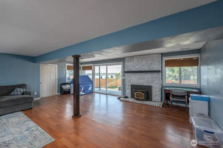 Let's step downstairs! Another fireplace down here, can help save energy costs during the cold months!