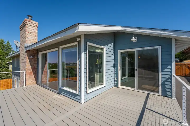 Upstairs Patio with double access makes for great hangout space to sip & chit chat, Grill & Chill, or soak up some evening sunsets!