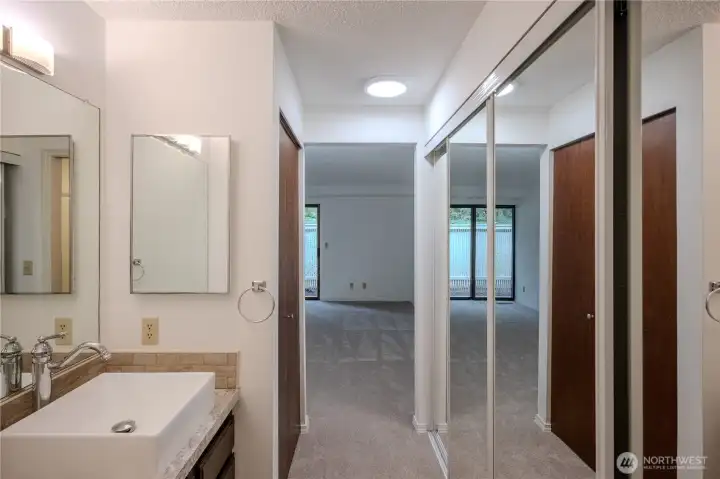Primary ensuite bathroom with closet
