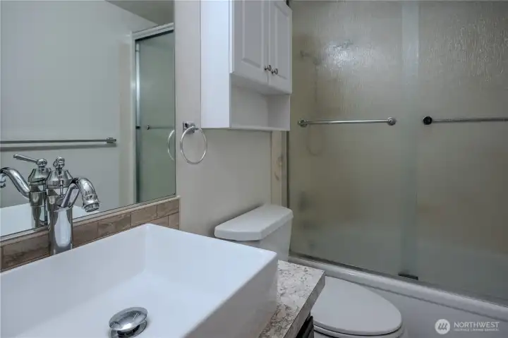 Second bathroom with full tub and shower