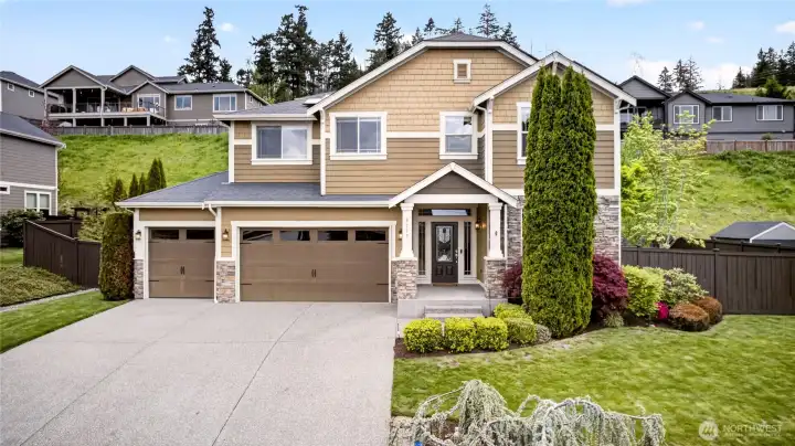 Situated on a fully fenced and landscaped quarter-acre lot, this home offers a spacious 3-car garage, additional driveway parking for up to three vehicles, and a welcoming covered front entry.