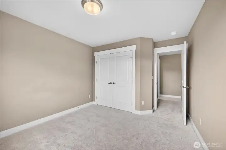 Second and third bedrooms are nicely sized with ample closet space and easy access to the main bathroom—perfect for guests, home office needs, or everyday living.