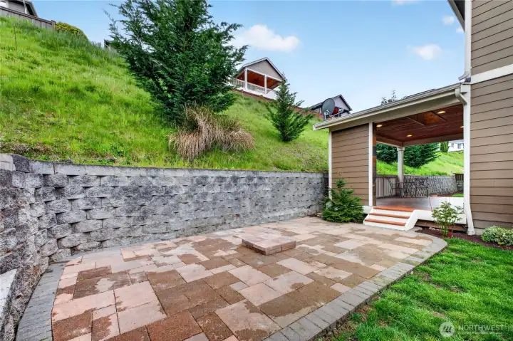 Additional brick patio offers the perfect space for outdoor dining, gatherings, or simply enjoying the beautifully maintained backyard.