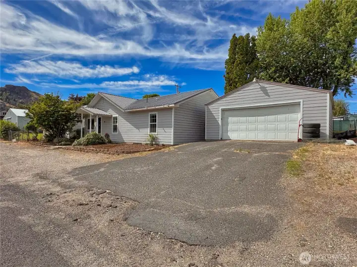 Detached 2-car garage with driveway and off street parking
