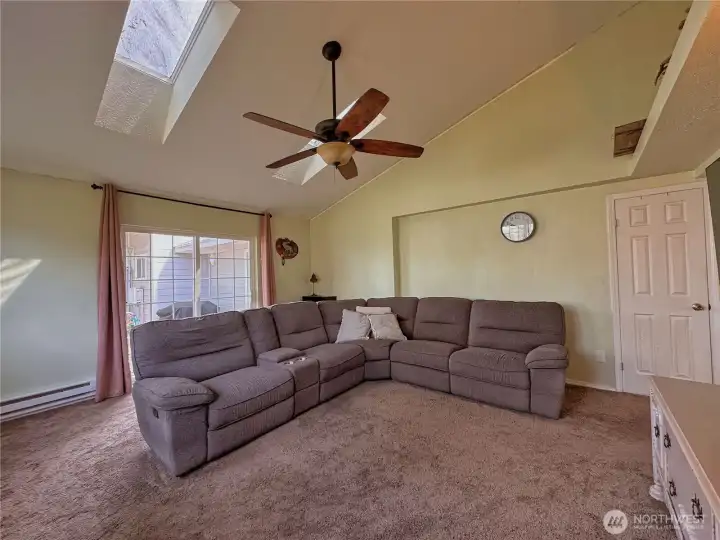 Sliding door leads to patio and fenced backyard