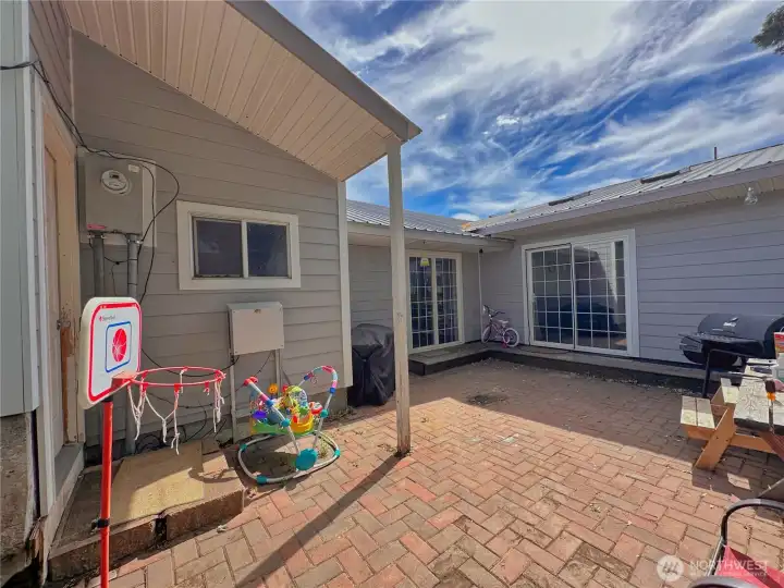 Sliding glass doors to family room and primary bedroom and double car garage access