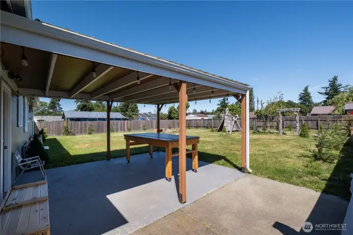 View of patio. Notice cedar storage box for outdoor needs. View of patio. Notice cedar storage box for outdoor needs.