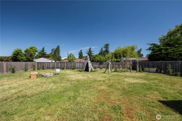 The abundance of space in the back yard is enhanced by the wide array of spruce, fir, and cypress trees planted along the entire fence to add a measure of privacy as they grow. The abundance of space in the back yard is enhanced by the wide array of spruce, fir, and cypress trees planted along the entire fence to add a measure of privacy as they grow.