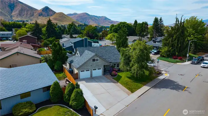 Welcoming exterior with mature landscaping and oversized driveway Welcoming exterior with mature landscaping and oversized driveway