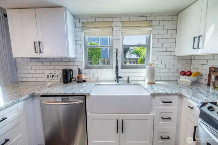 Bright kitchen workspace overlooking the yard Bright kitchen workspace overlooking the yard