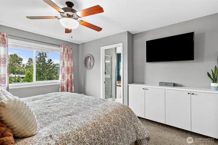 Primary Bedroom with custom California Closet Organizers & Storage