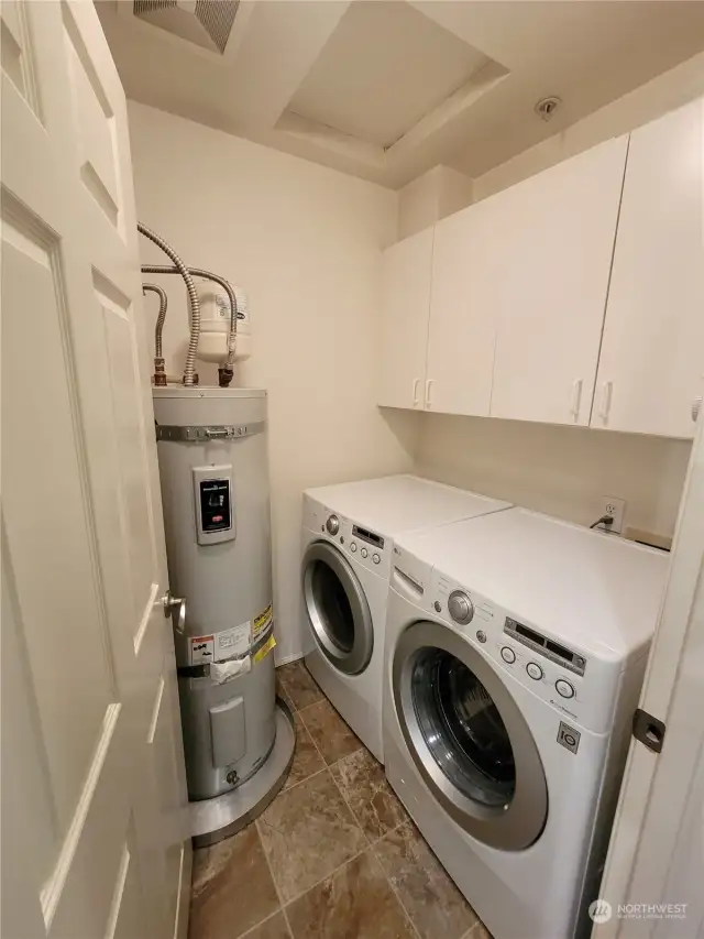 Laundry Room with Cabinets & Hot Water Tank
